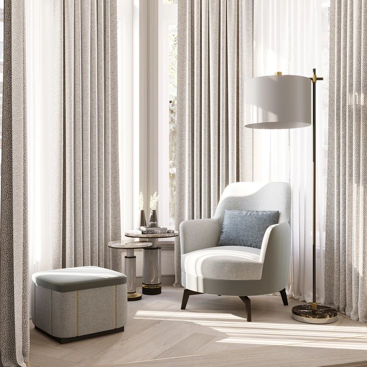 a living room with white curtains and a chair in front of a lamp on a table