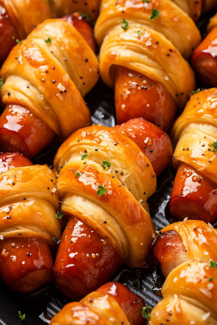 hotdogs wrapped in crescented bread and garnished with parsley