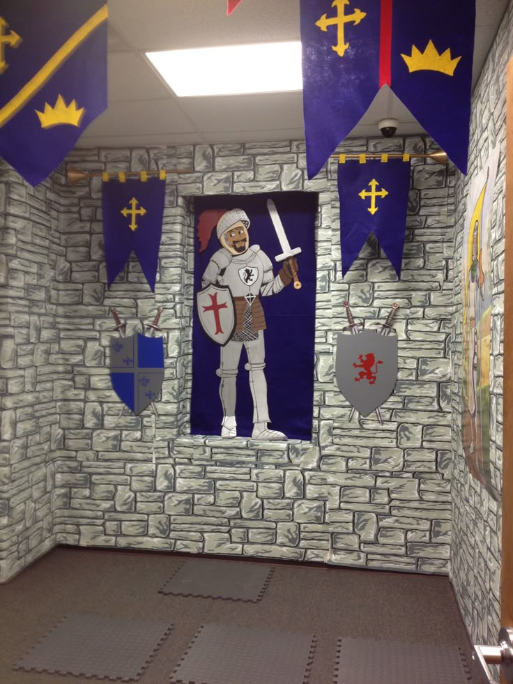 a room decorated with paper cutouts, flags and knights on the walls is shown