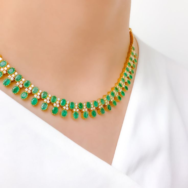 Unleash your inner diva with this 18k Yellow Gold Emerald and Diamond Necklace Set, weighing 41.8g. Encrusted with 2.95 ct diamonds of F-G color and VS quality, this set radiates luxury. With an adjustable link, matching earrings, and a screw-back post, it's perfect for any occasion. The hook lock adds to its elegance. This high fashion set is a must-have in your collection. PRODUCT DETAILS Gold Purity(karat): 18k Item Weight(grams): 41.8 Item Finish: Yellow Gold Stone: Diamond Diamond Weight(ca Green Diamond Necklace For Formal Occasions, Formal Green Hallmarked Diamond Necklace, Green Hallmarked Diamond Necklace Fine Jewelry, Green Hallmarked Diamond Necklace, Exquisite Green Diamond Necklace For Formal Occasions, Gold Emerald Necklace Hand Set Fine Jewelry, Elegant Yellow Gold Plated Emerald Necklace, Elegant Yellow Gold-plated Emerald Necklace, Elegant Yellow Gold Emerald Necklace With Diamond Accents