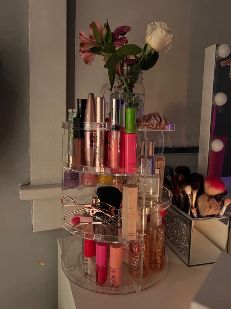 there are many different types of cosmetics on the counter top in this bathroom vanity mirror