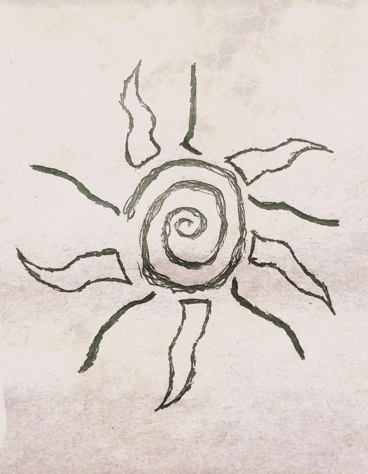 a drawing of a sun that is drawn on paper