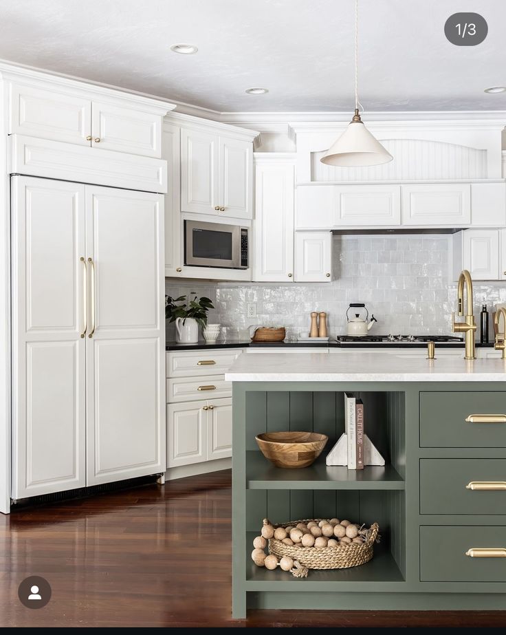 a kitchen with white cabinets and green island in front of the countertop, along with baskets on the floor