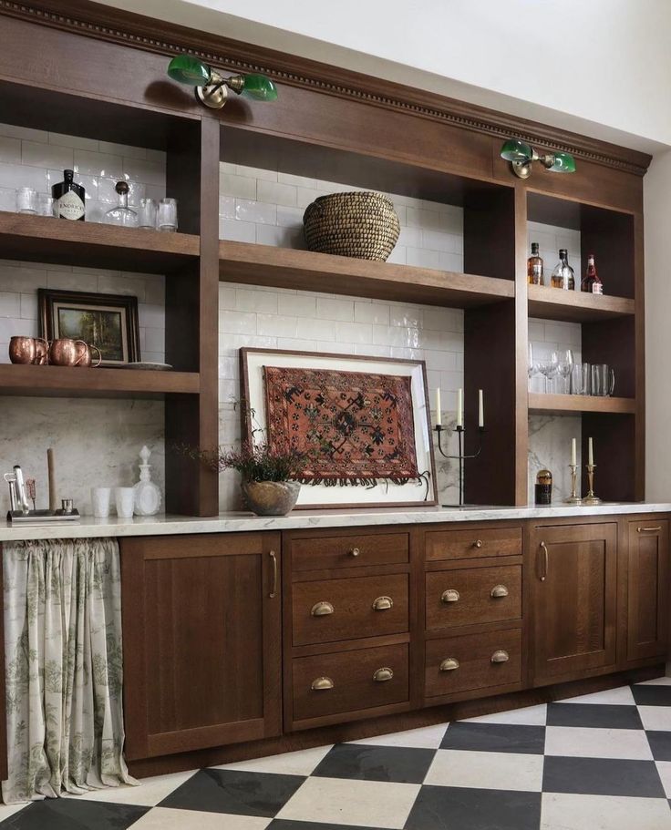 a kitchen with black and white checkered flooring, wooden cabinets and open shelving