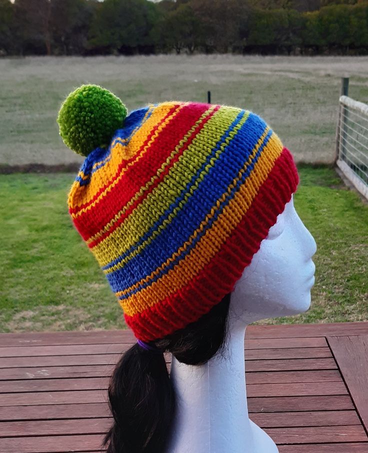 A bright and colourful pure wool beanie to brighten your winter days and keep your head cosy and warm! Hand-knitted in Nundle Mill's machine washable 12ply yarn. Multicolor Wool Hat For Winter, Multicolor Knitted Wool Beanie, Multicolor Beanie Cap For Winter, Multicolor Wool Knitted Beanie, Multicolor Winter Beanie Cap, Playful Multicolor Winter Beanie, Playful Knit Beanie, Colorful Winter Beanie Hat, Playful Multicolor Hats For Cold Weather