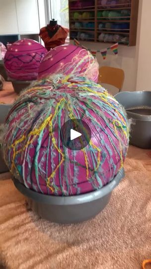 the yarn is on top of the bowl and ready to be used as a decoration