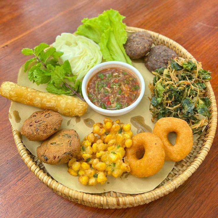 an assortment of food is arranged on a plate with lettuce and other foods