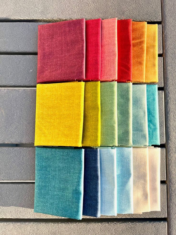 several colors of fabric laid out on top of each other