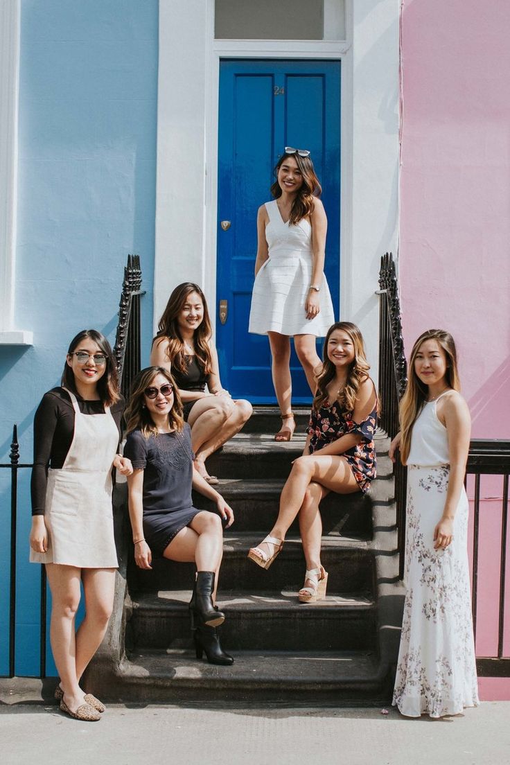 a group of women standing next to each other on steps