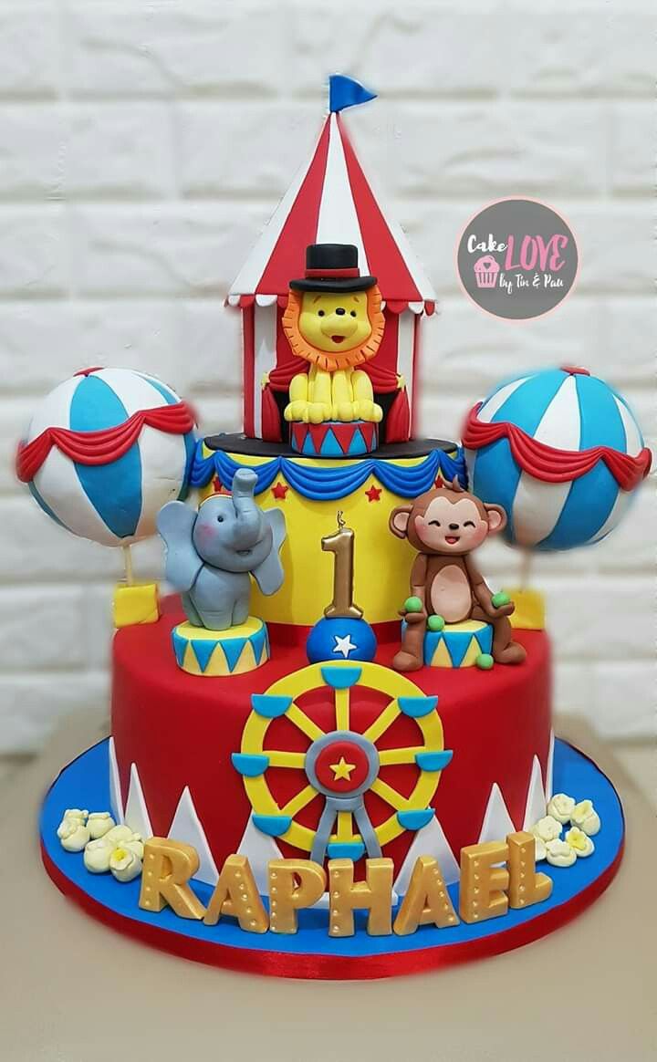 a birthday cake with circus animals on top