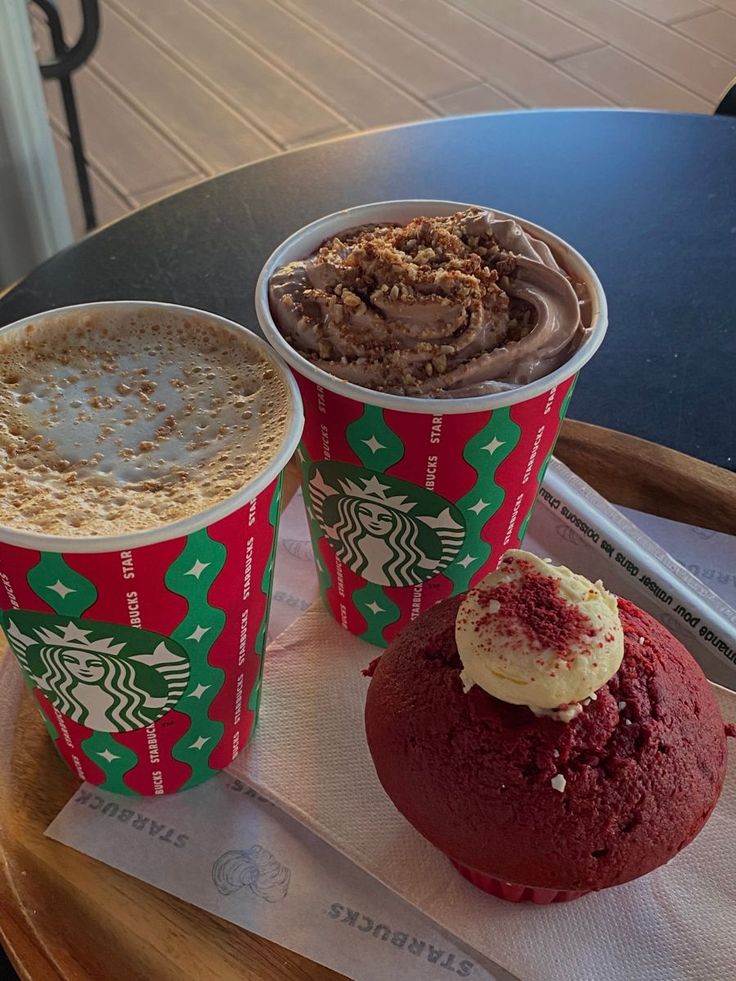 three different types of desserts on a table with paper napkins and coffee cups