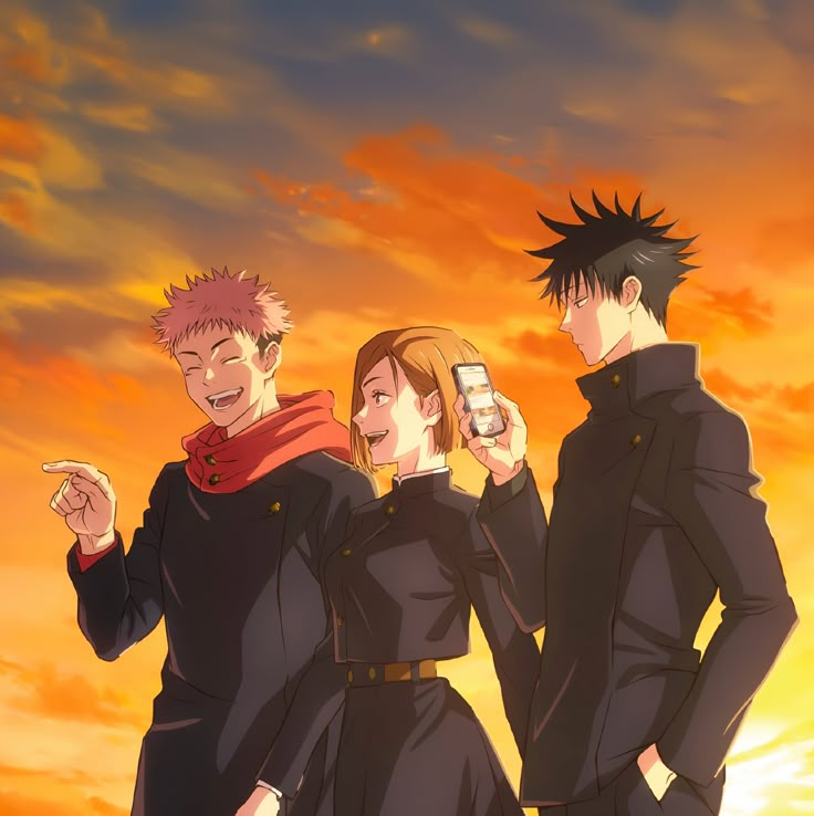 three people standing in front of an orange sky