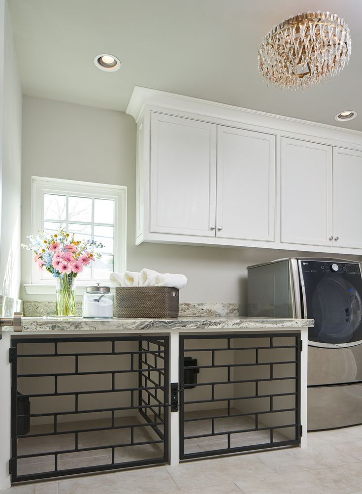 a washer and dryer in a white kitchen