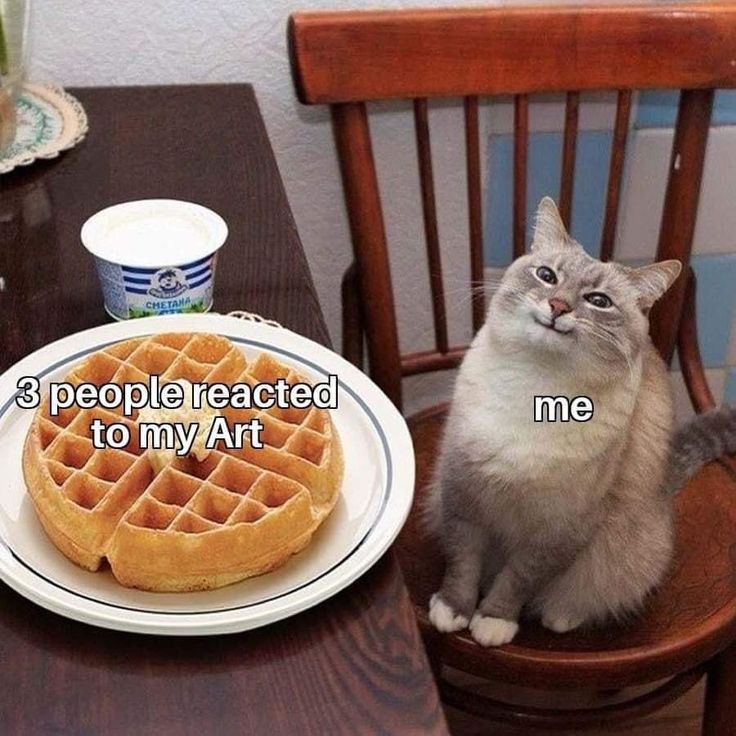 a cat sitting on a chair next to a plate of waffles with the caption taking care of others