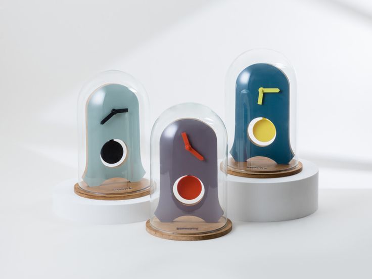 three clocks with different shapes and sizes on them