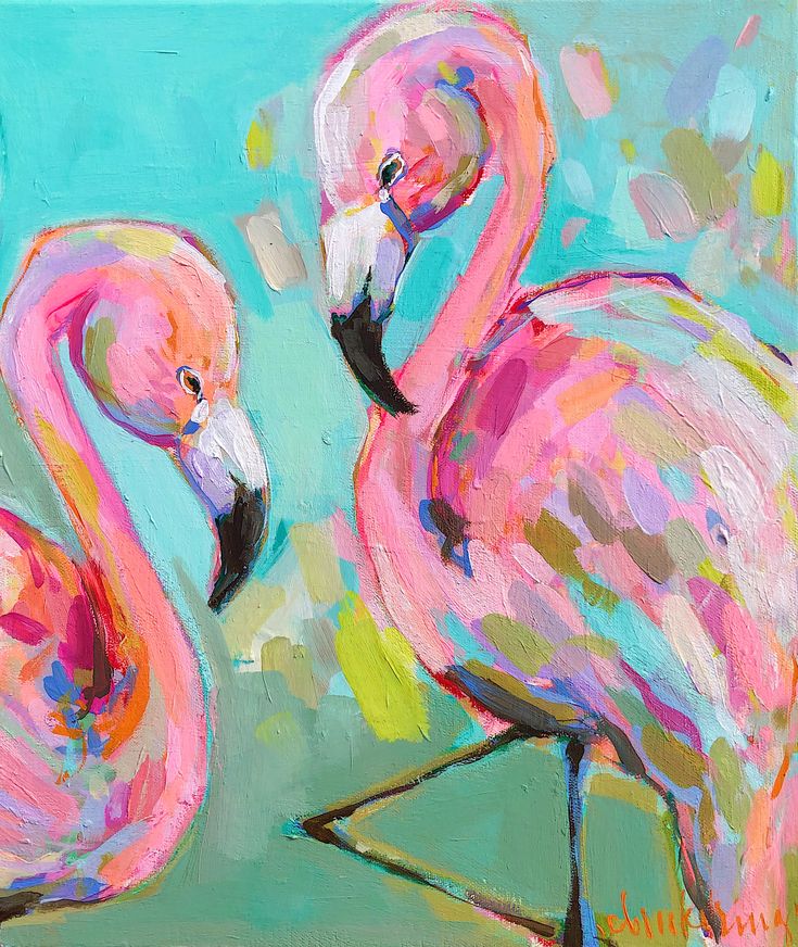 two pink flamingos standing next to each other