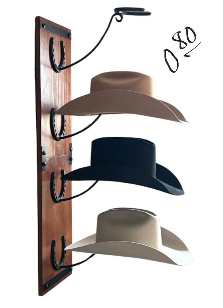 three hats are hanging on the wall and one is wearing a hat rack with hooks