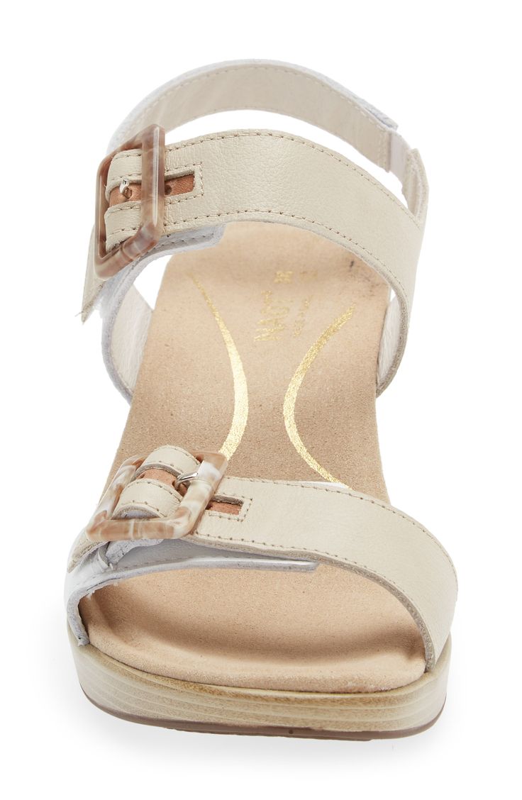 Adjustable buckles at the vamp and ankle help customize the fit of this supportive sandal lifted on a block heel. 2 1/4" heel; 1/2" platform Leather upper and lining/synthetic sole Imported Cream Wedge Sandals With Heel And Ankle Strap, Cream Wedge Sandals With Heel Strap And Block Heel, Cream Wedge Sandals With Block Heel And Heel Strap, Beige Low Heel Sandals With Buckle Closure, Beige Wedge Sandals With Buckle Closure And Block Heel, Cream Block Heel Wedge Sandals With Heel Strap, Beige Wedge Sandals With Buckle And Block Heel, Medium Width Low Heel Wedge Sandals With Buckle, Beige Ankle Strap Wedge Sandals With Buckle