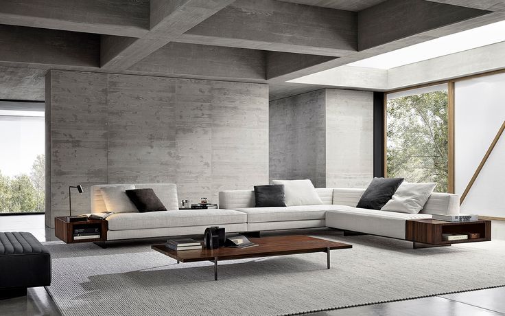 a modern living room with concrete walls and flooring