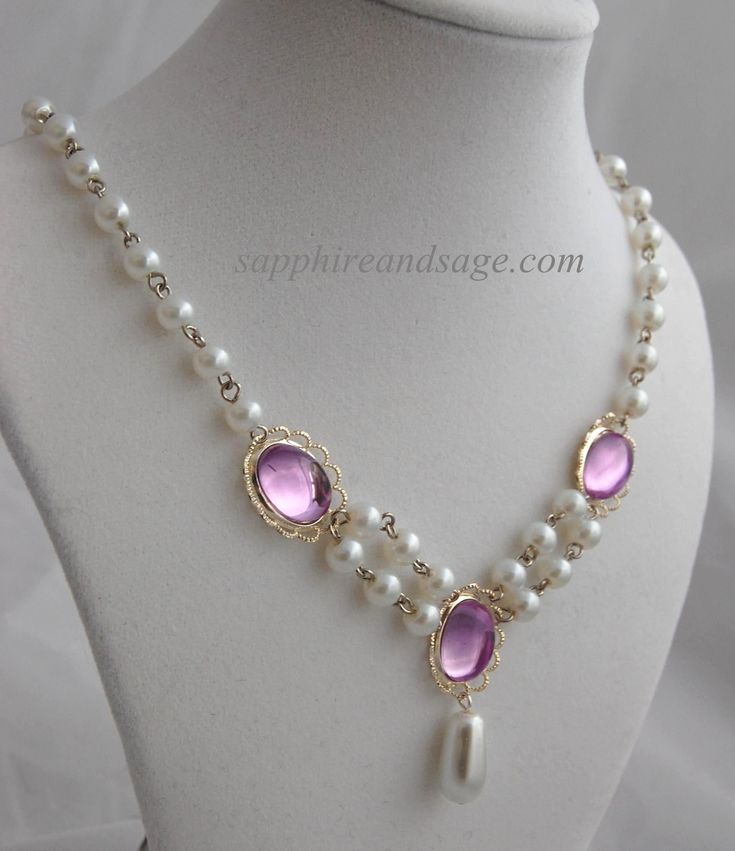 This exquisite Renaissance-style necklace is a timeless classic. Featuring 14x 10mm acrylic gems and 6mm creamy white glass pearls, this dainty piece will add a hint of luxury to any Renaissance and Victorian look. The Irina necklace will add a subtle touch of elegance to any garb ensemble. Necklace length is 17-18", with a 2-3" extender attached. Longer and shorter lengths available upon request, message me with your desired length. Elegant Amethyst Jeweled Necklaces, Elegant Amethyst Jewel Necklace, Elegant Amethyst Necklace, Classic Amethyst Necklaces For Wedding, Elegant Pearl Necklaces With Faceted Beads, Elegant Pearl White Necklace With Faceted Beads, Elegant Pearl Necklace With Faceted Beads As A Gift, Elegant Purple Pearl Necklace For Wedding, Elegant Faceted Pearl Necklace