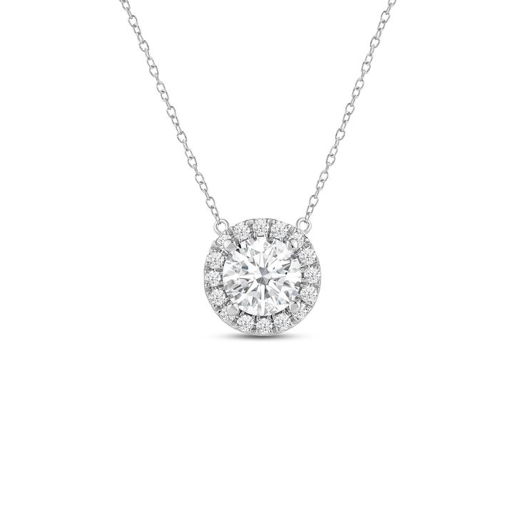 That one piece that will inject a shot of glamour into your looks. This white gold necklace features round diamond surrounded by a halo of smaller round diamonds. Four prongs secure the center diamond in place. The timeless look of this necklace allows you to pair it with almost any of your favorite outfits. Timeless Diamond Pendant Necklace With Halo Setting, Timeless Halo Pendant Diamond Necklace, Classic Diamond Necklace With Halo Detail, Classic Diamond Halo Necklace, White Gold Diamond Pendant With Halo Setting, Fine Jewelry Diamond Necklace With Halo Setting, White Gold Diamond Pendant Necklace With Halo Setting, Classic Solitaire Necklace With Halo In Cubic Zirconia, Dazzling Diamond White Solitaire Necklace With Halo