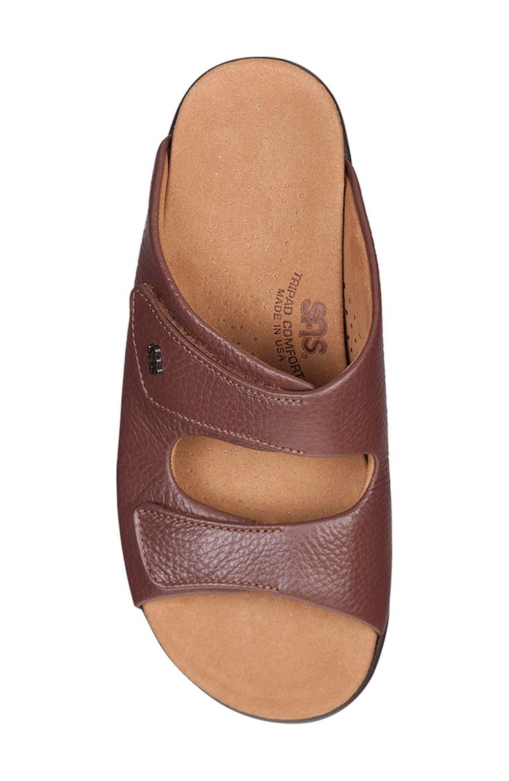 This slide sandal has an incredibly cushioned microfiber footbed that contours to the natural shape of the foot, while a comfort sole rebounds with each step. Adjustable hook-and-loop straps Cushioned footbed with arch support Shock-absorbing sole Leather upper/textile lining/synthetic sole Made in the USA Brown Slides With Ortholite Insole And Round Toe, Comfortable Brown Slides With Arch Support, Brown Slip-on Slides With Arch Support, Brown Slides With Cushioned Footbed, Comfortable Closed Toe Slides With Removable Insole, Comfortable Open Toe Slides With Ortholite Insole, Comfortable Open Toe Slippers With Removable Insole, Comfortable Open-toe Slippers With Ortholite Insole, Classic Open Toe Slippers With Cushioned Footbed