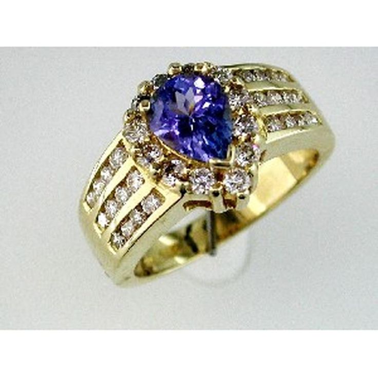 Enchanting Royal 14K Yellow Gold Tanzanite & Diamond Ring - 1.10 Carat Pear Shape Tanzanite, 1.00 Carat Round Diamonds Classic Tanzanite Ring For Formal Occasions, Classic Tanzanite Diamond Ring With Prong Setting, Formal Tanzanite Ring With 17 Jewels, Yellow Gold Diamond Ring With Tanzanite In Prong Setting, Classic Tanzanite Rings With Brilliant Cut, Classic Tanzanite Ring With Center Stone, Yellow Gold Tanzanite Rings With Brilliant Cut, Classic Tanzanite Wedding Ring With Prong Setting, Classic Amethyst Ring With Brilliant Cut For Formal Occasions