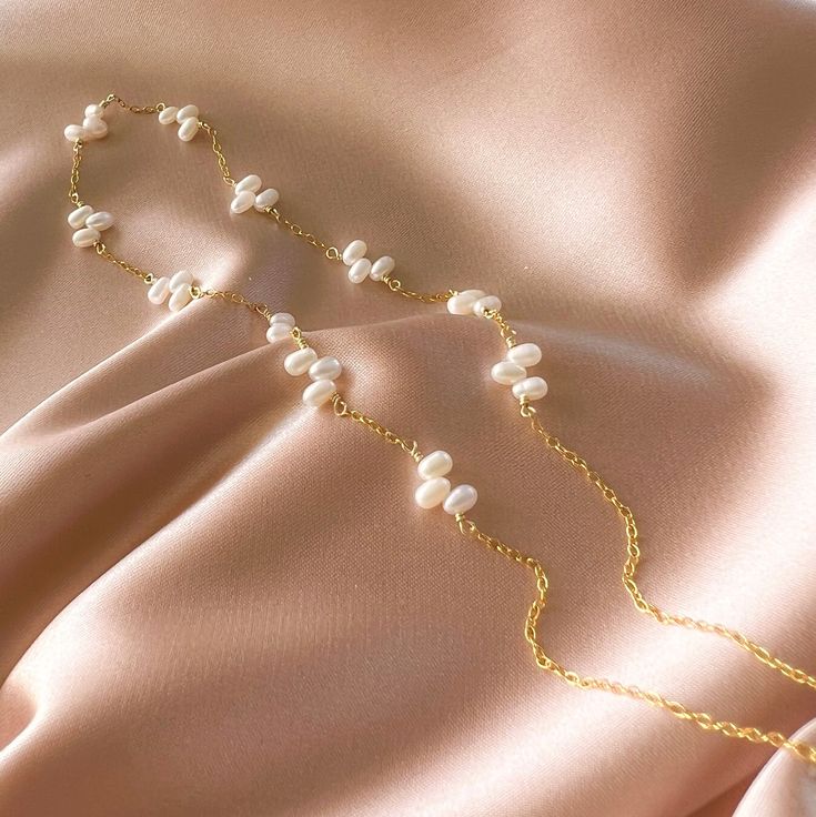 This delicate freshwater bead pearl necklace stands on it's own as a classic wardrobe staple and can be layered with any necklace.Handmade and attached to a delicate 14k gold-plated chain.Adjustable length "16-18". Dainty Single Strand Pearl Necklace In 14k Gold, Adjustable Gold Plated Pearl Necklace With Pearl Drop, Adjustable Delicate 14k Gold-filled Pearl Necklace, Delicate Adjustable 14k Gold Filled Pearl Necklace, Adjustable Delicate 14k Gold Filled Pearl Necklace, Handmade 14k Gold-filled Elegant Pearl Necklace, Delicate Gold Single Strand Pearl Necklace, Handmade Elegant 14k Gold-filled Pearl Necklace, Elegant Handmade Pearl Necklace With 14k Gold Filled