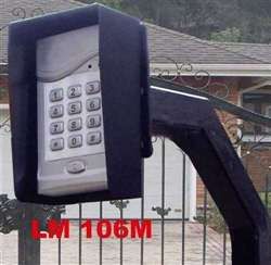 an old cell phone is attached to a metal fence with a gate in the background