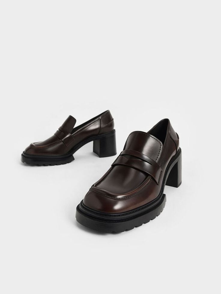 Infuse your outfits with a dose of elegance with these penny loafer pumps. Made in a rich glossy dark-brown colour, these loafers add a hint of luxury to whatever you are wearing. Maximising walkability and accessibility with the slip-on design, these shoes are perfect for busy days. Plus the sturdy chunky heels offer the perfect lift. Style these shoes with beige pinstripe trousers, a white crisp shirt and a saddle bag for a classy and chic workwear look. Chic Workwear, Loafer Pumps, Pinstripe Trousers, Kids Belt, Brown Loafers, Faux Leather Heels, Size Chart For Kids, Dark Brown Color, Charles Keith