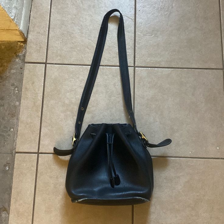 Black Coach Bucket Bag With Drawstring Closure. Inside Pocket. Adjustable Strap And Brass Hardware. Has Some Wear But A Lot Of Life Left In It. Please See Pics For Condition. Coach Bucket Bag, Black Bucket Bag, Bags Black, Brass Hardware, Coach Bags, Inside Pocket, Bucket Bag, Adjustable Straps, Bag Lady