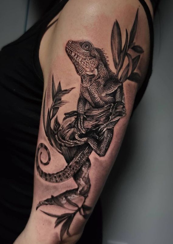 a woman with a lizard tattoo on her arm