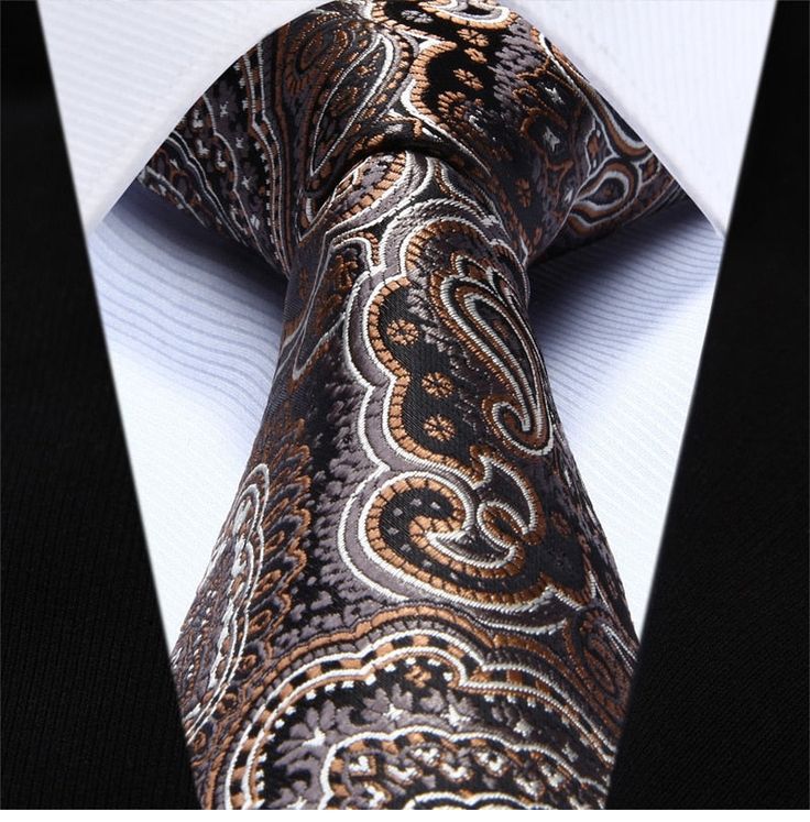 Brown and White Paisley Necktie Take your look up a level with this elaborate brown paisley necktie with detailed accents. Choose From: Single Tie Tie and Pocket Square Material of Tie: 100% Silk Dimensions of Pocket Square: 10.5” Inches x 10.5” Inches Length of Tie: Regular (60”) XL (63”) Width of Tie: 3.4" Inches Pattern On Fabric: Stitched Paisley Color Of Fabric: Brown Elegant Multicolor Formal Neckwear, Elegant Business Suit And Tie Accessories With Paisley Print, Elegant Paisley Print Suit And Tie Accessories For Gift, Elegant Paisley Print Tie As A Gift, Elegant Paisley Print Ties As Gift, Elegant Multicolor Neckwear With Ties, Elegant Multicolor Neckwear For Business, Elegant Multicolor Business Neckwear, Elegant Paisley Print Neckwear For Business