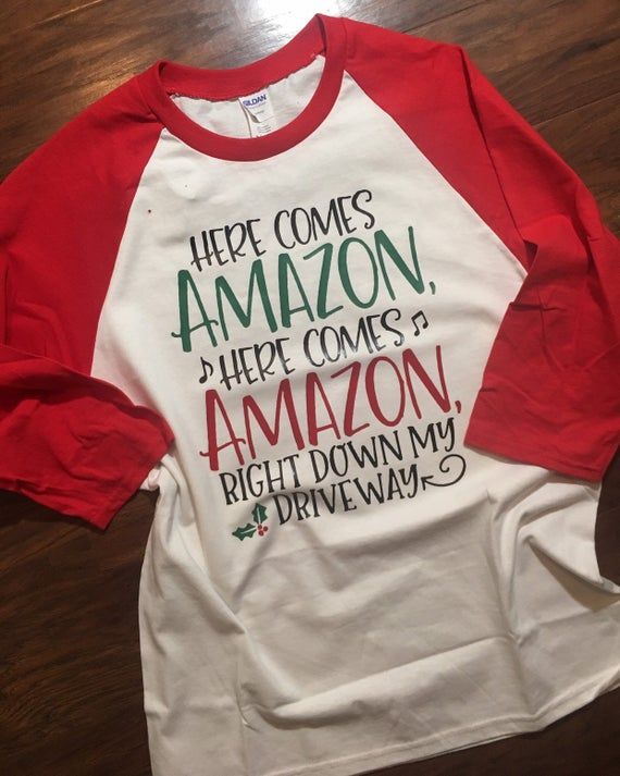 Here Comes Amazon Christmas shirt | Funny Christmas shirt, Amazon lover gift, Christmas Shirt Ideas Funny, Xmas Packaging, Christmas Shirt Ideas, Christmas Doors, Here Comes Santa Claus, Quote Svg Files, Christmas Shirt Funny, Amazon Christmas, Cricket Ideas