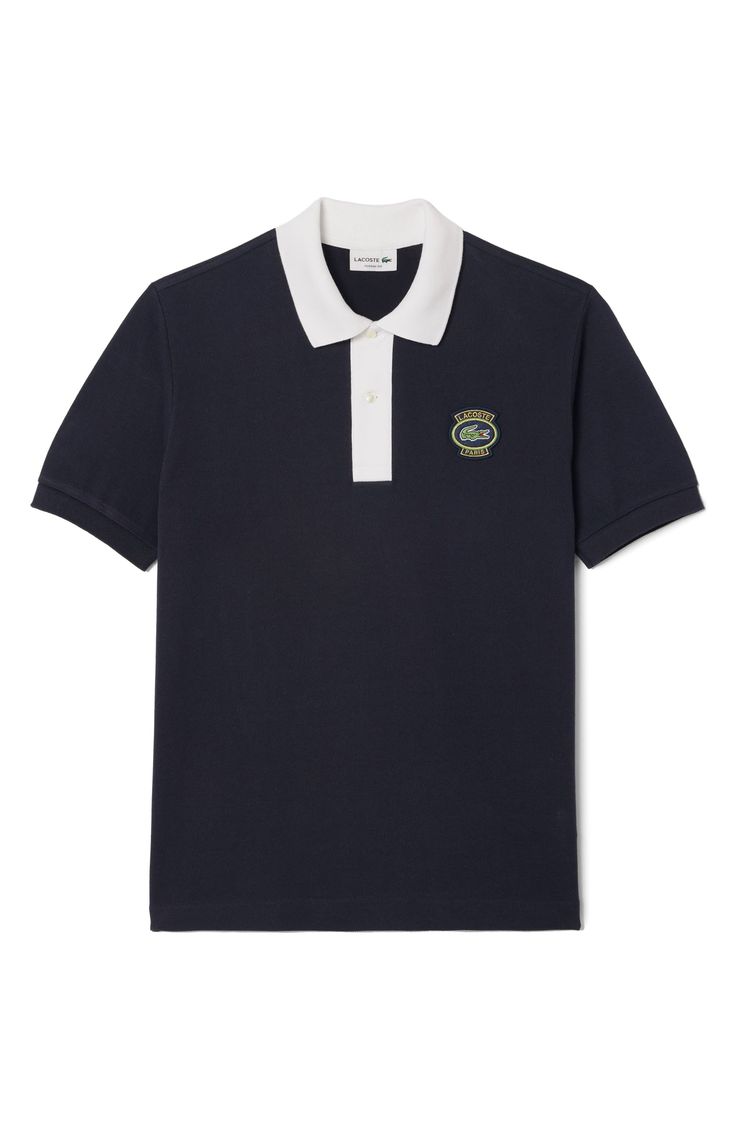 An embroidered logo patch and pops of contrast on the collar and placket energize a polo made of cotton piqué and styled to keep you all-activity comfortable. 28" length Button half placket Spread collar Short sleeves 100% cotton Machine wash, line dry Made in Turkey Casual Navy Polo Shirt With Embroidered Logo, Casual Cotton Polo Shirt With Logo Detail, Casual Cotton Polo Shirt With Logo, Sporty Polo Shirt With Embroidered Logo, Sporty Collared Polo Shirt With Embroidered Logo, Cotton Polo Shirt With Logo Patch, Sporty Polo Shirt With Contrast Collar, Casual Cotton Polo Shirt With Logo Patch, Casual Polo Shirt With Logo Patch