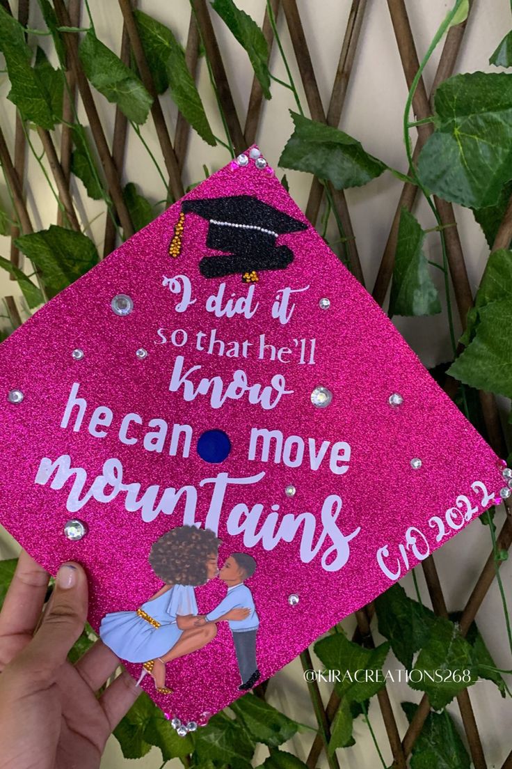 a pink graduation cap that says, dad it's so that i know he can move mountains