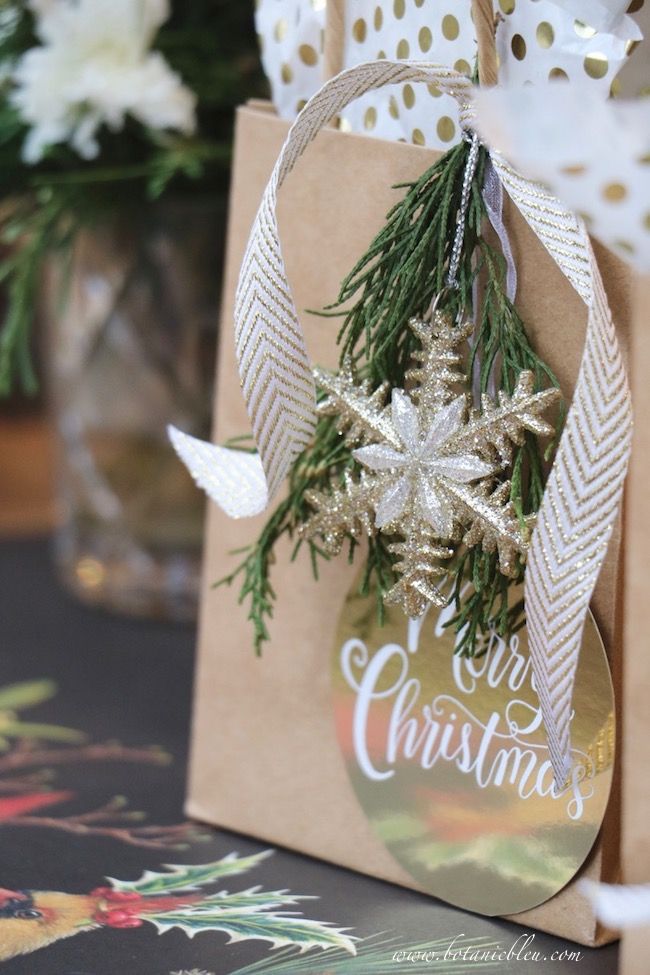 a brown paper bag with a christmas ornament hanging from it