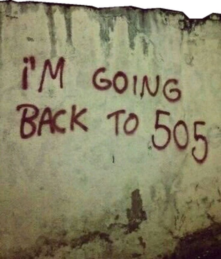 graffiti on the side of a building that says i'm going back to 50