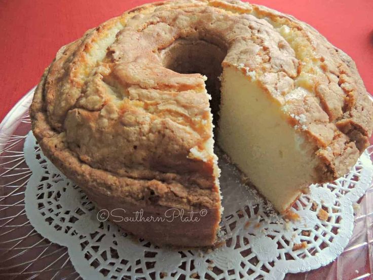 a cake that has been cut into pieces and is on top of a doily