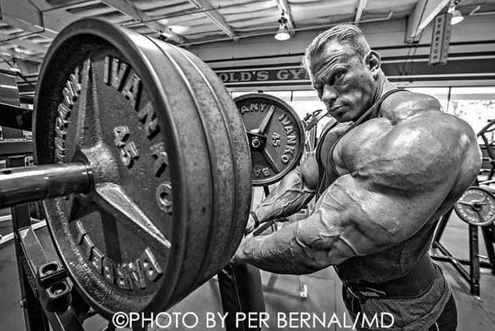 a man is working out with a barbell