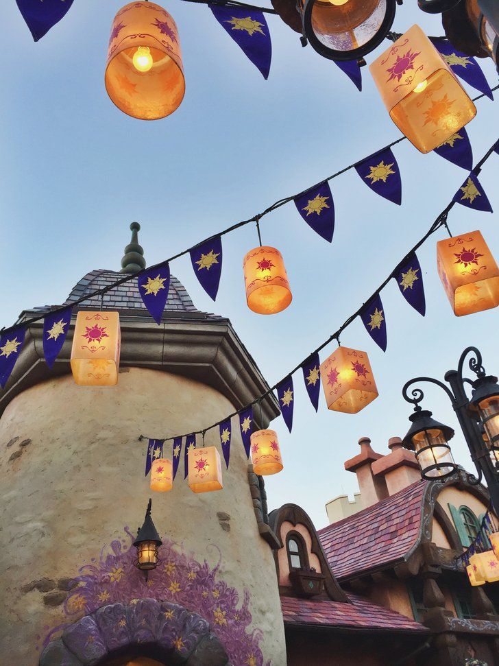 many lanterns are hanging from the roof of a building at disneyland's hollywood studios