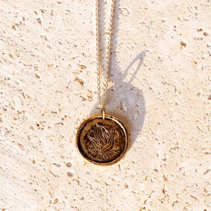 Description This heavy medallion necklace evokes the feel of an ancient coin and serves as a substantial reminder of The Four Agreements for both men and women. Use it as a touchstone throughout the day, focusing on the relevant agreement in each moment, and deepen your practice of Don Miguel Ruiz' wisdom from the best-selling book. The necklace showcases the book's flower on one side and engraves all The Four Agreements on the reverse. Engraved Text: Be impeccable with your word Don't take anyt Affordable Silver Engraved Medallion Necklace, Adjustable Medallion Necklace With Oxidized Finish, Impeccable With Your Word, Be Impeccable With Your Word, Luxury Tarnish-resistant Sterling Silver Medallion Necklace, Gold-tone Metal Pendant Medallion Necklace, Bronze Tarnish-resistant Medallion Necklace, Spiritual Sterling Silver Medallion Necklace, Tarnish Resistant, The Four Agreements