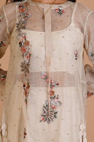 Ivory jute silk tunic with multi-colored floral and thread embroidery. Comes with an inner. - Aza Fashions Bohemian Style Kurta For Spring Wedding, Multicolor Embroidered Dress With Dupatta For Spring, Spring Dresses With Multicolor Embroidery And Dupatta, Off White Embroidered Dresses For Transitional Seasons, Designer Off White Dupatta For Spring, Cream Sets With Floral Embroidery For Transitional Season, Festive Cream Embroidered Dress, Transitional Floral Embroidered Cream Sets, Off White Festive Sets For Spring