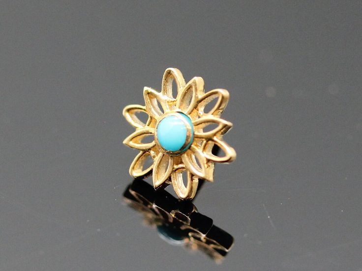 Pin with Marisol- 7mm- Negative space flower with 2mm bezel center 2mm Turquoise round (1) 27g Push Pin Flat Tops made from solid 14k Solid gold  (NOT plated or filled) compatible with neometal push pin bases Gold Threadless Ends. "Press-fit" gem ends. The threadless or "press-fit" system is an effective alternative to internally-threaded body jewelry and is currently in wide use by many body piercers. WHAT'S THE DIFFERENCE IN GOLD COLORS? The three different gold colors are the perfect array. T Pierced Flower-shaped Gold Plated Jewelry, Negative Space Flower, Gold Spiritual Jewelry With Flower Shape, Evil Eye Belly Button Ring, 18g Nose Ring, Medusa Piercing Jewelry Opal, Vertical Labret Jewelry Flower, Medusa Piercing, Septum Jewelry