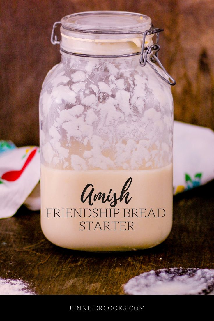 a glass jar filled with food sitting on top of a wooden table