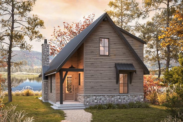 a small house with a stone walkway leading to the front door