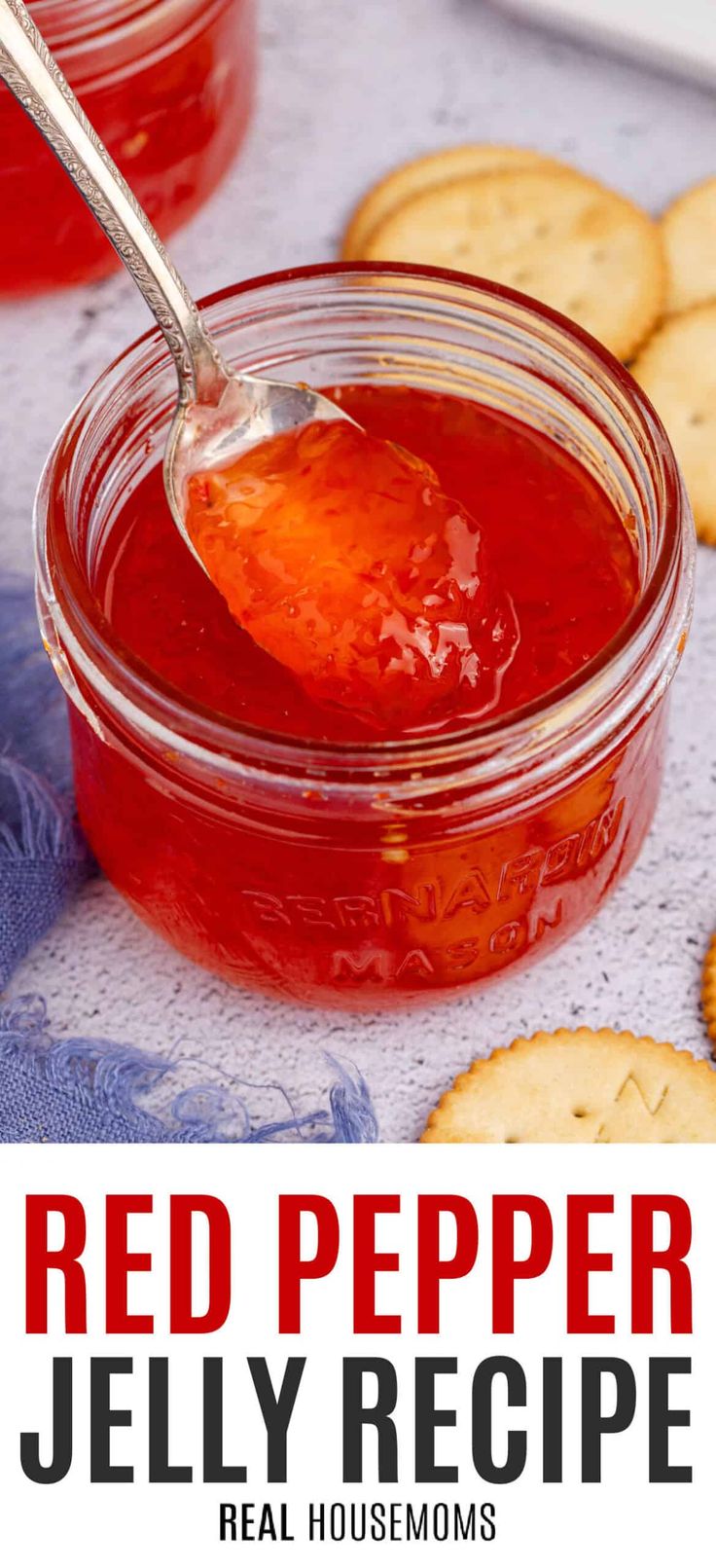 red pepper jelly recipe in a jar with crackers on the side and text overlay