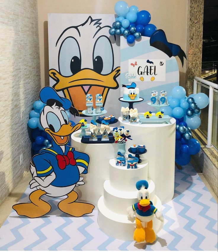 a blue and white birthday party with donald duck