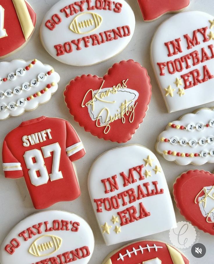 decorated cookies are arranged in the shape of heart and football jerseys with words on them