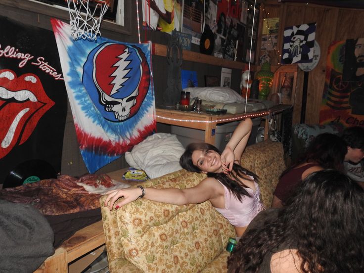 a woman laying on top of a chair in a room